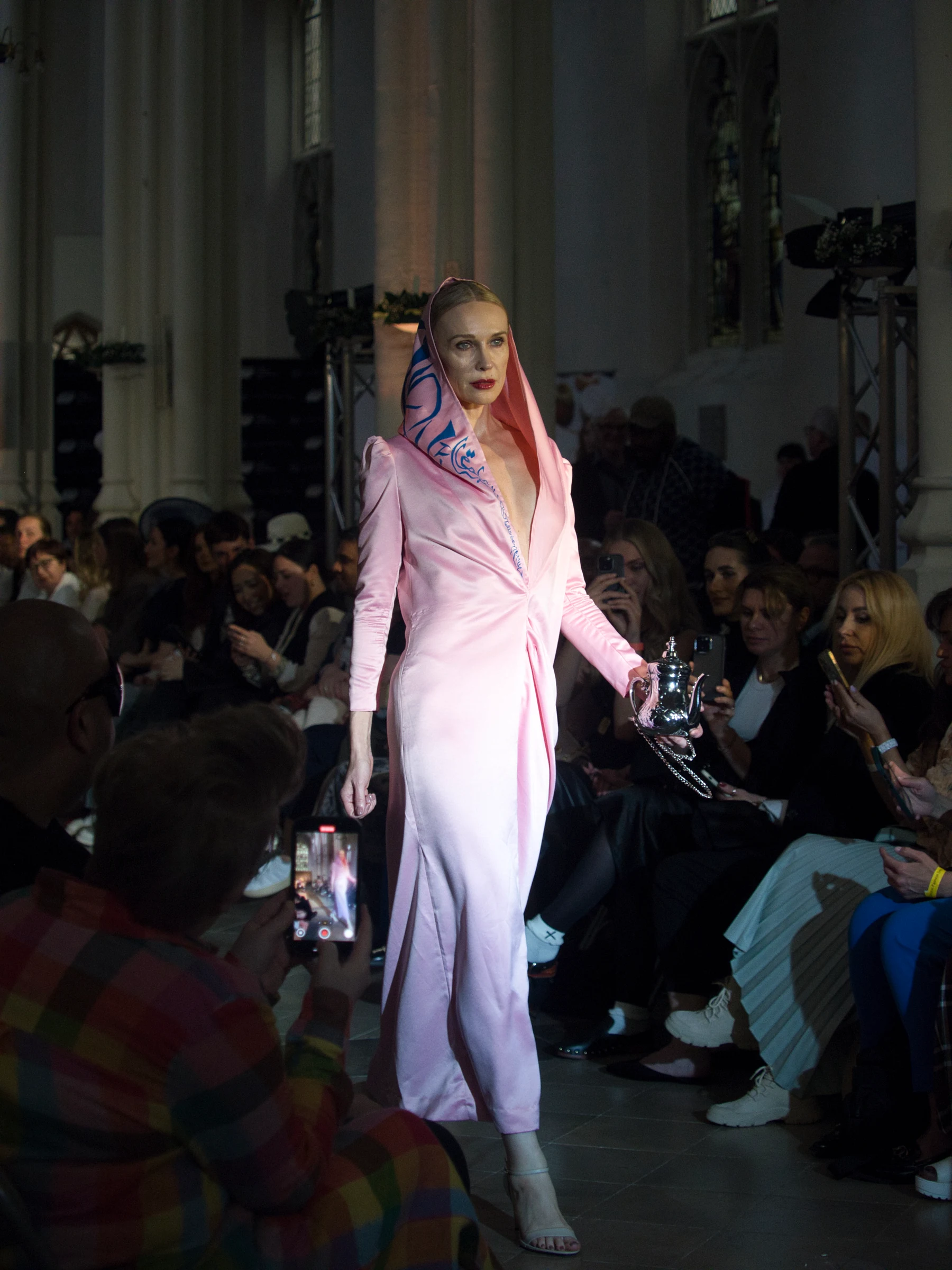 High fashion runway model in stride under spotlights (P4260759)